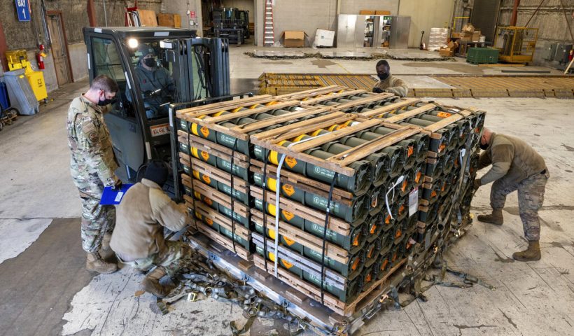 FILE - In this image provided by the U.S. Air Force, Airmen and civilians from the 436th Aerial Port Squadron palletize ammunition, weapons and other equipment bound for Ukraine during a foreign military sales mission at Dover Air Force Base, Del., on Jan. 21, 2022. Western weaponry pouring into Ukraine helped blunt Russia's initial offensive and seems certain to play a central role in the approaching battle for Ukraine's contested Donbas region. Yet the Russian military is making little headway halting what has become a historic arms express. (Mauricio Campino/U.S. Air Force via AP)