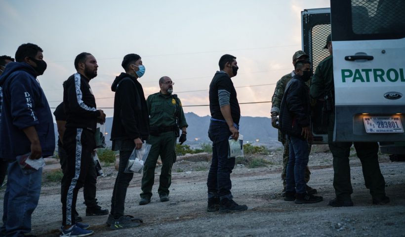 Migrants caught crossing the US-Mexico border are loaded into a transport van by US Border Patrol agents in Sunland Park, New Mexico on July 22, 2021. - Many advocates from national organizations urge President Biden to end Title 42 expulsions, a public health order issued in March 2020 by the Centers for Disease Control and Prevention to prevent the cross-border spread of Covid-19 resulting of hundreds of thousands of migrants expelled within hours of detention and therefore deny the opportunity to state their case for staying in the country. (Photo by PAUL RATJE / AFP) (Photo by PAUL RATJE/AFP via Getty Images)