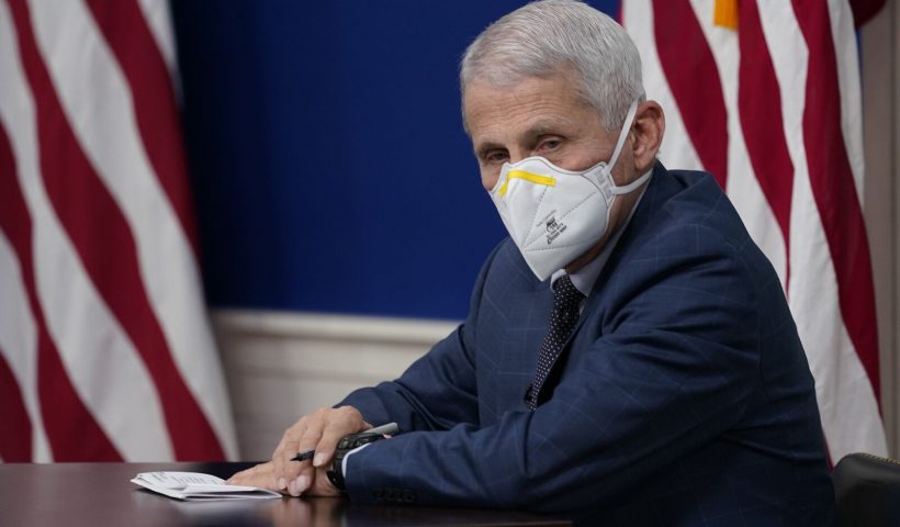 Dr. Anthony Fauci, the top U.S. infectious disease expert, wears a face mask during the White House COVID-19 Response Team's regular call with the National Governors Association in the South Court Auditorium in the Eisenhower Executive Office Building on the White House Campus, Monday, Dec. 27, 2021, in Washington. (AP Photo/Carolyn Kaster)