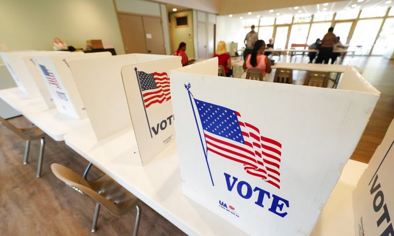 Empty poll kiosks await voters at the Mississippi Second Congressional District Primary election precinct, Tuesday, June 7, 2022, in Jackson, Miss. A light turnout of voters is expected statewide during the midterm primary election. (AP Photo/Rogelio V. Solis)