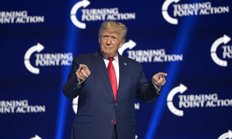 Former President Donald Trump reacts before addressing attendees during the Turning Point USA Student Action Summit, Saturday, July 23, 2022, in Tampa, Fla. (AP Photo/Phelan M. Ebenhack)