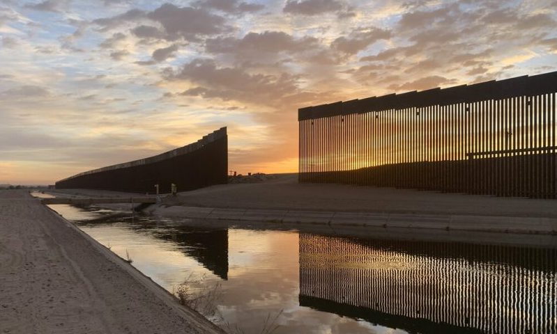 The sun sets above the U.S.-Mexico border wall, seen in Yuma, Ariz., Wednesday, June 9, 2021. The Biden administration says it has identified more than 3,900 children separated from their parents at the U.S.-Mexico border under former President Donald Trump's "zero-tolerance" policy on illegal crossings. The Border Patrol's Yuma sector recorded the highest number of separations of the agency's nine sectors on the Mexican border. (AP Photo/Eugene Garcia)