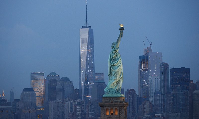 NEW YORK, NY - SEPTEMBER 8: in The Statue of Liberty stands in the foreground as Lower Manhattan is viewed at dusk, September 8, 2016 in New York City. New York City is preparing to mark the 15th anniversary of the September 11 terrorist attacks. (Photo by Drew Angerer/Getty Images)