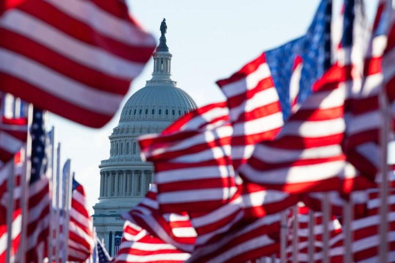 TOPSHOT - US flags representing those who could not attend the inauguration due to Covid-19, flutter in the wind at the Mall before the Inauguration of US President-Elect Joe Biden in Washington, DC on January 20, 2021. (Photo by ROBERTO SCHMIDT / AFP) (Photo by ROBERTO
SCHMIDT/AFP via Getty Images)
