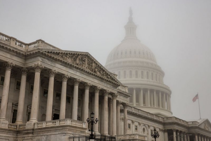 WASHINGTON, DC - NOVEMBER 04: Early morning fog envelopes the U.S. Capitol dome behind the U.S. House of Representatives on November 4, 2022 in Washington, DC. Republicans are poised to regain control of the U.S. Congress in the midterm elections on November 8 after the Democrats gained the majority in both the House in 2018 and Senate in 2020. (Photo by Samuel Corum/Getty Images)