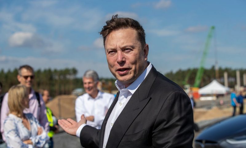 GRUENHEIDE, GERMANY - SEPTEMBER 03: Tesla head Elon Musk talks to the press as he arrives to to have a look at the construction site of the new Tesla Gigafactory near Berlin on September 03, 2020 near Gruenheide, Germany. Musk is currently in Germany where he met with vaccine maker CureVac on Tuesday, with which Tesla has a cooperation to build devices for producing RNA vaccines, as well as German Economy Minister Peter Altmaier yesterday. (Photo by Maja Hitij/Getty Images)