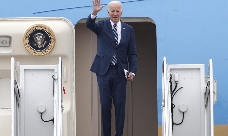 President Joe Biden waves as he boards Air Force One, Tuesday, Dec. 6, 2022, at Andrews Air Force Base, Md. Biden is traveling to Arizona to visit the building site for a new computer chip plant and speak about his economic agenda.(AP Photo/Luis M. Alvarez)