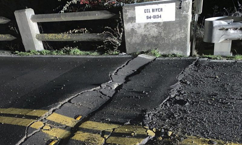 This image posted by Caltrans District 1 shows a road closure on California State Route 211 at Fernbridge, a 1,320-foot-long (402.3 m) concrete arch bridge that spans the Eel River near Fortuna, Calif., in Humboldt County. The bridge is closed while they conduct a safety inspection checking for possible seismic damage. Officials say a strong earthquake in Northern California has cut off power to thousands and damaged roads and homes. No injuries have been reported in the magnitude 6.4 earthquake early Tuesday near Ferndale. That's a small community over 200 miles northwest of San Francisco and close to the Pacific Coast. (Caltrans District 1 via AP)