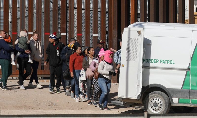 Venezuelan and Nicaraguan migrants are transferred by agents of the Border Patrol after crossing the Rio Grande river from Ciudad Juarez, Chihuahua state, Mexico to El Paso, Texas, US to ask for political asylum on December 27, 2022. - The US government's two-year-old policy of invoking Covid-19 precautions to turn away hundreds of thousands of migrants at the Mexican border will remain in place for now, the Supreme Court ruled Tuesday. The decision to uphold the controversial rule known as Title 42 stemmed off a looming political crisis for President Joe Biden, as thousands waited at the southern border in expectation the policy was about to end. (Photo by Herika Martinez / AFP) (Photo by HERIKA MARTINEZ/AFP via Getty Images)