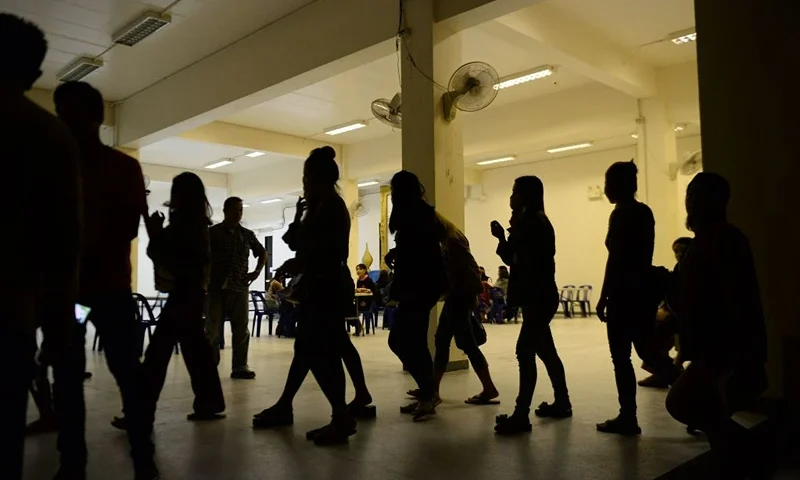 A group of foreign women rounded up by police from karaoke bars in Thailand's southern province of Narathiwat are taken to city hall during a campaign against prostitution and human trafficking involving women and minors on November 9, 2018. - About 50 Laotian women were rounded up by authorities for investigation. (Photo by Madaree TOHLALA / AFP) (Photo credit should read MADAREE TOHLALA/AFP via Getty Images)
