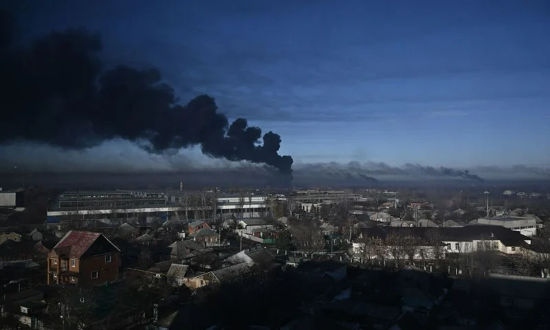 TOPSHOT - Black smoke rises from a military airport in Chuguyev near Kharkiv on February 24, 2022. - Russian President Vladimir Putin announced a military operation in Ukraine today with explosions heard soon after across the country and its foreign minister warning a "full-scale invasion" was underway. (Photo by Aris Messinis / AFP) (Photo by ARIS MESSINIS/AFP via Getty Images)