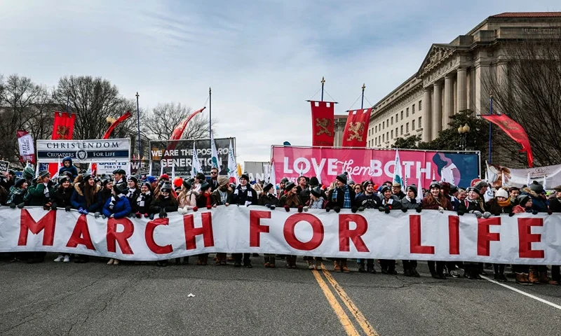 WASHINGTON, DC - JANUARY 21: Anti-abortion activists march to the U.S. Supreme Court during the 49th annual March for Life rally on January 21, 2022 in Washington, DC. The rally draws activists from around the country who are calling on the Court to overturn the Roe v. Wade decision that legalized abortion nationwide. (Photo by Anna Moneymaker/Getty Images)