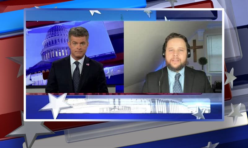Video still from Ricardo Martins' interview with Real America on One America News Network