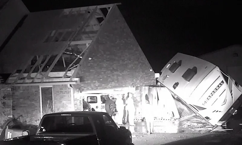 In this grab taken from video provided by KOCO, a view of the damage to a property after severe storms, in Shawnee, Oklahoma, late Sunday, Feb, 26, 2023. Powerful storms with widespread wind gusts and reported tornadoes swept across Oklahoma and Kansas, leaving more than a dozen people injured, and Michigan residents faced a fifth straight day Monday without power following last week’s ice storm. (KOCO via AP)