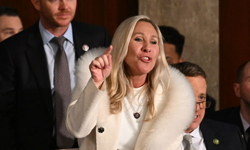 US Republican Representative Marjorie Taylor Greene (R-GA) yells as US President Joe Biden delivers the State of the Union address at the US Capitol in Washington, DC, February 7, 2023. (Photo by Jim WATSON / AFP) (Photo by JIM WATSON/AFP via Getty Images)