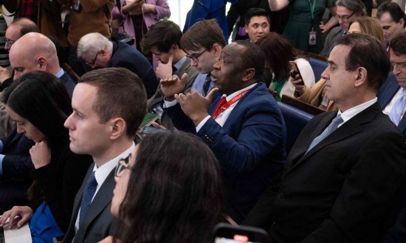 Today News Africa reporter Simon Ateba (C) interrupts as White House Press Secretary Karine Jean-Pierre (not pictured), begins the daily press briefing in the Brady Press Briefing Room of the White House in Washington, DC, March 20, 2023. (Photo by SAUL LOEB / AFP) (Photo by SAUL LOEB/AFP via Getty Images)