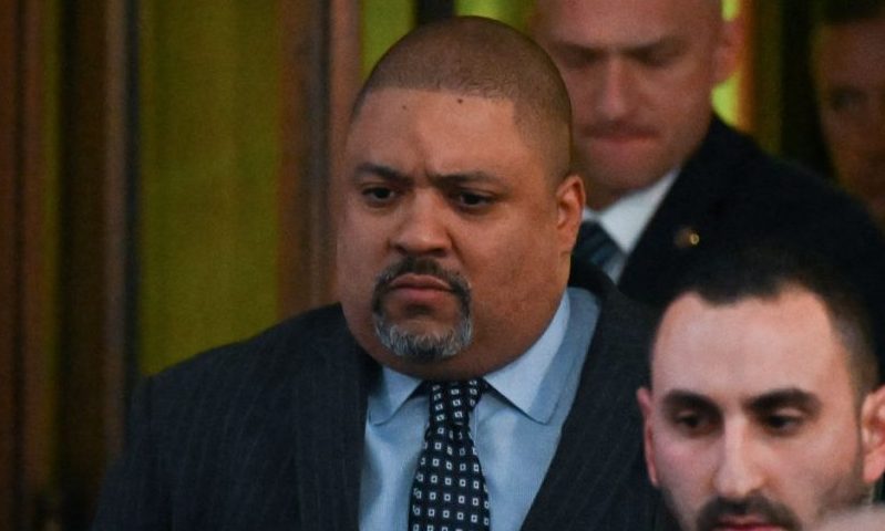 Manhattan District Attorney Alvin Bragg (L) leaves his office in New York on March 30, 2023. - Manhattan district attorney Alvin Bragg became the first prosecutor in US history to charge a former or sitting president when he filed his indictment against Donald Trump. The 49-year-old Democrat is no stranger to landmark moments: he is the first Black Manhattan DA, winning election to the post in November 2021. (Photo by Ed JONES / AFP) (Photo by ED JONES/AFP via Getty Images)
