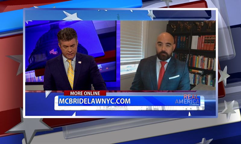 Video still from Joseph McBride's interview with Real America on One America News Network