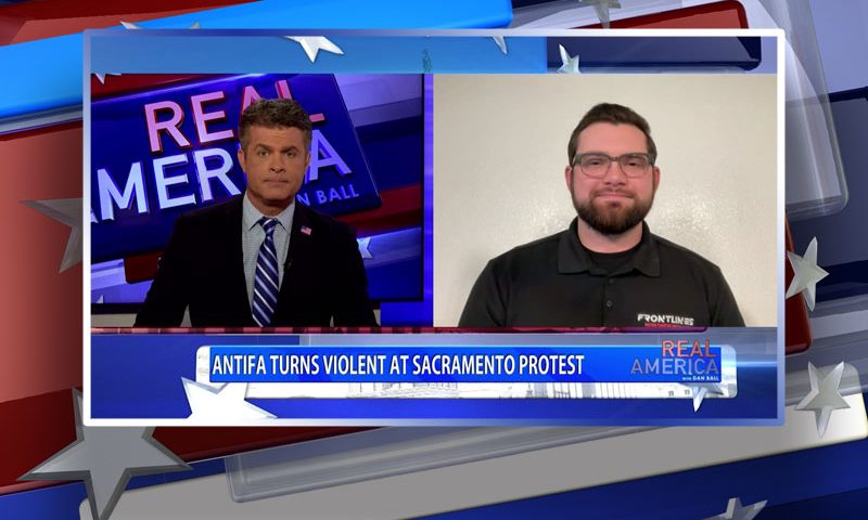 Video still from Kalen D'Almeida's interview with Real America on One America News Network
