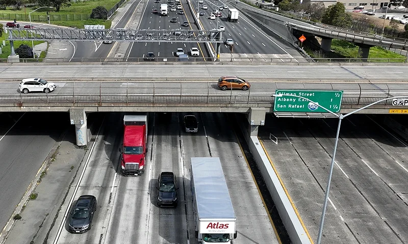 BERKELEY, CALIFORNIA - MARCH 31: In an aerial view, trucks move along Interstate 80 on March 31, 2023 in Berkeley, California. The U.S. Environmental Protection Agency (EPA) announced that it will allow California's plan to phase out a variety of diesel-powered trucks in the state and require truck manufacturers to sell more zero-emission electric trucks. Half of all heavy trucks sales of heavy truck in California will have to be electric by 2035. (Photo by Justin Sullivan/Getty Images)