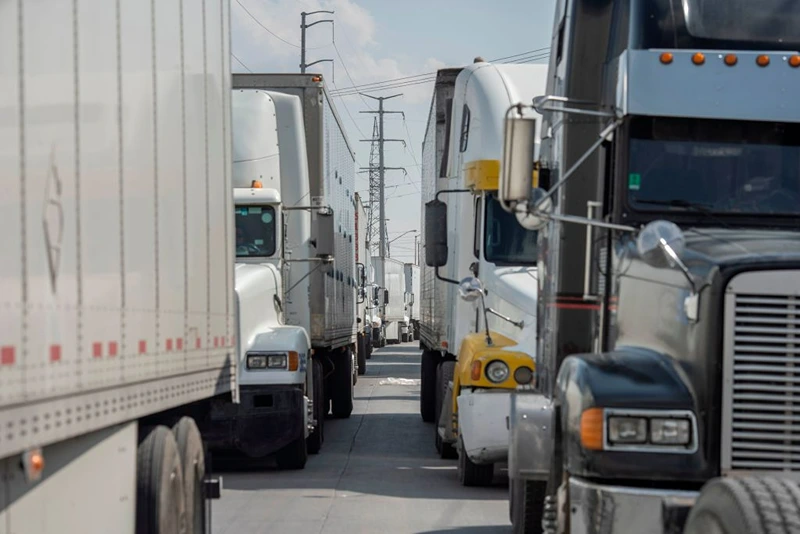 Semi-trucks wait for inspection before crossing the border at the Zaragoza International Bridge, in Juarez, Mexico, across the border from El Paso, Texas on May 31, 2019. - President Donald Trump escalated his abrupt tariff threats against Mexico, triggering alarm about the likely economic fallout, spooking global markets and raising the prospect of US trade wars on multiple fronts. Trump unexpectedly announced his readiness to levy tariffs on all Mexican imports, beginning at five percent starting June 10 and rising monthly to as high as 25 percent until Mexico substantially reduces the flow of illegal immigration. (Photo by Paul Ratje / AFP) (Photo credit should read PAUL RATJE/AFP via Getty Images)