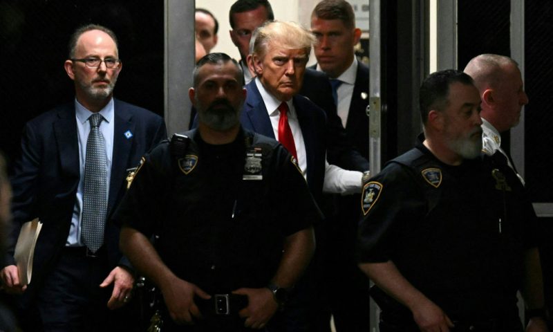 Former US President Donald Trump makes his way inside the Manhattan Criminal Courthouse in New York on April 4, 2023. - Donald Trump will make an unprecedented appearance before a New York judge on April 4, 2023 to answer criminal charges that threaten to throw the 2024 White House race into turmoil. (Photo by Ed JONES / AFP) (Photo by ED JONES/AFP via Getty Images)