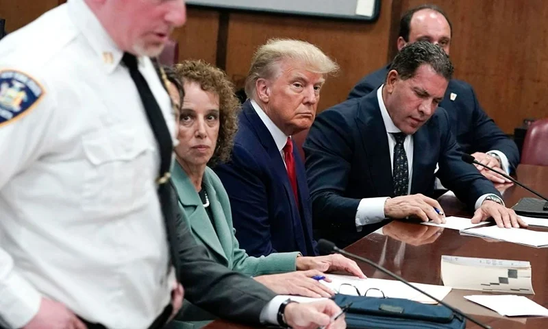 Former US president Donald Trump appears in court at the Manhattan Criminal Court in New York on April 4, 2023. - Former US president Donald Trump arrived for a historic court appearance in New York on Tuesday, facing criminal charges that threaten to upend the 2024 White House race. (Photo by Seth WENIG / POOL / AFP) (Photo by SETH WENIG/POOL/AFP via Getty Images)