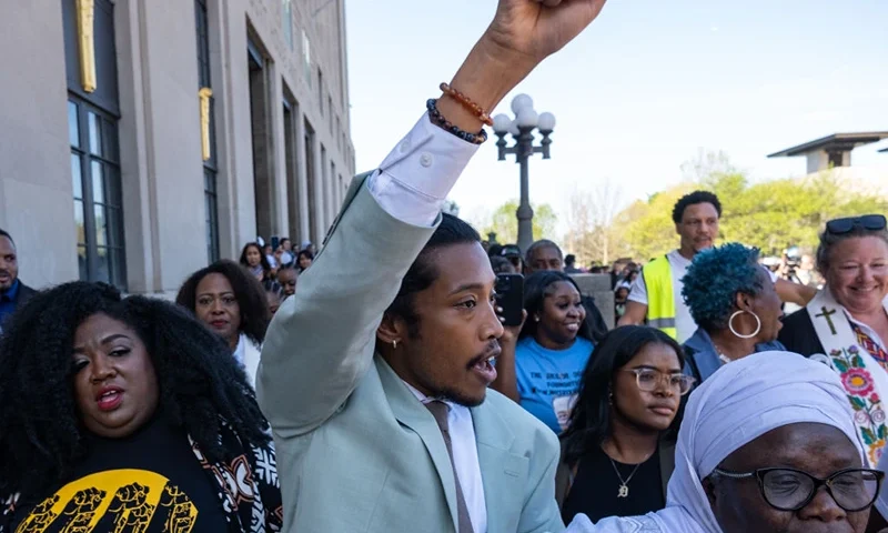 State Rep. Justin Jones of Nashville raises his fist after being reinstated to his seat on April 10, 2023 in Nashville, Tennessee. The move comes days after the Democrat was expelled for leading a protest on the House floor for gun reform in the wake of a mass shooting at a Christian school in which three 9-year-old students and three adults were killed by a 28-year-old former student on March 27. (Photo by Seth Herald/Getty Images)