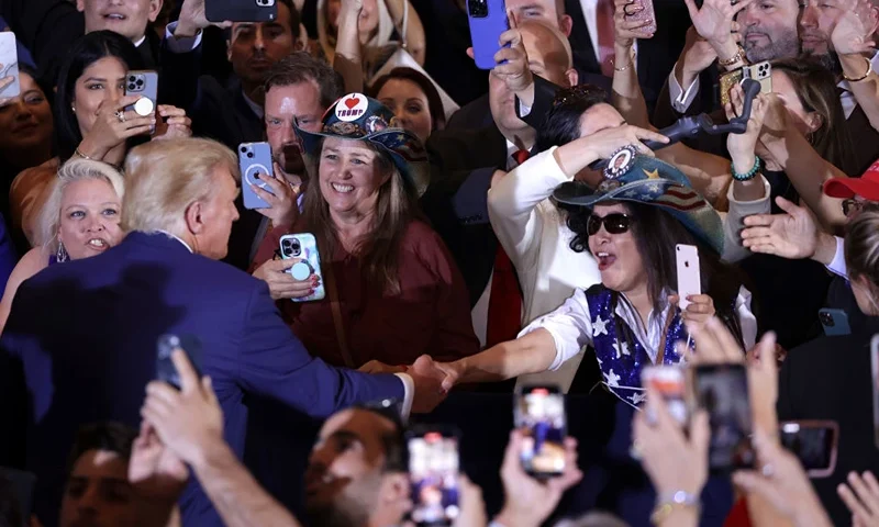 WEST PALM BEACH, FLORIDA - APRIL 04: Former U.S. President Donald Trump (L) greets supporters during an event at Mar-a-Lago April 4, 2023 in West Palm Beach, Florida. Earlier in the day, Trump pleaded not guilty to 34 felony counts stemming from hush money payments in 2016 to two women, becoming the first former U.S. president in history to be charged with a criminal offense. (Photo by Alex Wong/Getty Images)