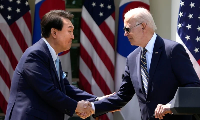 WASHINGTON, DC - APRIL 26: U.S. President Joe Biden (R) and South Korean President Yoon Suk-yeol shake hands during a joint press conference in the Rose Garden at the White House, April 26, 2023 in Washington, DC. President Biden is hosting President Yoon on his first visit to the United States as the two nations have reached a nuclear weapons agreement. (Photo by Drew Angerer/Getty Images)