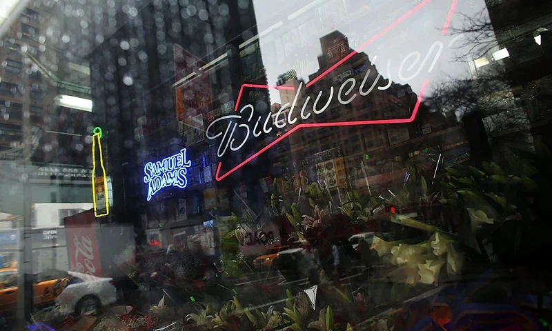 NEW YORK, NY - FEBRUARY 27: An advertisement for Budweiser beer is displayed in a deli window on February 27, 2013 in New York City. In a new class action lawsuit against Anheuser-Busch, beer enthusiasts have accused the company of watering down its Budweiser, Michelob and other beers. The suits, which were filed in Pennsylvania, California and other states, are seeking millions in damages for allegedly cheating customers out of the alcohol content stated on labels. Anheuser-Busch calls the suit groundless. (Photo by Spencer Platt/Getty Images)