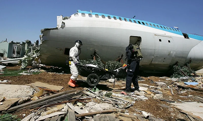 An FBI Hazardous Materials Team member in white and a member of the US Army Civil Support Team (CST) search for hazards during an exercise simulating mass casualties from the collision between a single-engine Cessna and a commercial airliner with levels of radioactivity present at the set built for the filming of ?War of the Worlds? at Universal Studios theme park on April 19, 2007 in Los Angeles, California. The exercise is taking place at the conclusion of three days of large-scale disaster preparedness exercises, based on the scenario of a terrorist attack in the wake of an earthquake. The exercise, called Operation Vector, was hosted by the California National Guard and is designed to promote interagency cooperation during a disaster or attack and evaluate the performance of responding agencies. It is expected to be the first in a series of similar events at landmark sights. (Photo by David McNew/Getty Images)