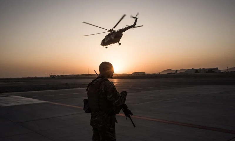 KANDAHAR, AFGHANISTAN - SEPTEMBER 9: A member of the United States Air Force keeps watch over the runway on September 9, 2017 at Kandahar Air Field in Kandahar, Afghanistan. Currently the United States has about 11,000 troops in the deployed in Afghanistan, with a reported 4,000 more expected to arrive in the coming weeks. With an increase in troops, American trainers hope to expand the capability of the Afghanistan Air Force. (Photo by Andrew Renneisen/Getty Images)