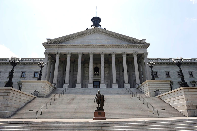 COLUMBIA, SC - JUNE 24: A sculpture of George Washington stands infront of the State Capitol Building before South Carolina Gov. Mark Sanford held a press conference at the State Capitol June 24, 2009 in Columbia, South Carolina. Sanford admitted to having an extramarital affair after returning from a secret trip to visit a woman in Argentina and said that he would resign as head of the Republican Governors Association. (Photo by Davis Turner/Getty Images)