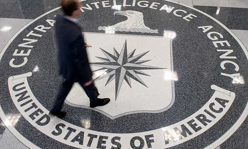 A man crosses the Central Intelligence Agency (CIA) logo in the lobby of CIA Headquarters in Langley, Virginia, on August 14, 2008. AFP PHOTO/SAUL LOEB (Photo by SAUL LOEB/AFP via Getty Images)