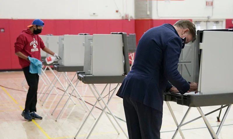Connecticut Governor Ned Lamont casts his vote at Greenwich High School in Greenwich, Connecticut on November 3, 2020. - The United States started voting Tuesday in an election amounting to a referendum on Donald Trump's uniquely brash and bruising presidency, which Democratic opponent and frontrunner Joe Biden urged Americans to end to restore "our democracy." (Photo by TIMOTHY A. CLARY / AFP) (Photo by TIMOTHY A. CLARY/AFP via Getty Images)