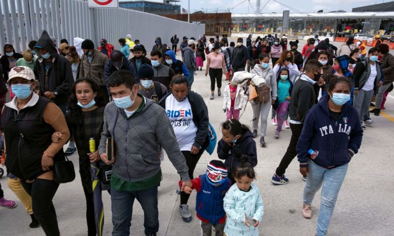 Migrants and asylum seekers awl after a demonstration at the San Ysidro crossing port asking US authorities to allow them to start their migration process in Tijuana, Baja California state, Mexico on March 23, 2021. - Migrants out of MPP program are stranded along the US-Mexico border without knowing when or how they will be able to start their migratory process with US authorities. (Photo by Guillermo Arias / AFP) (Photo by GUILLERMO ARIAS/AFP via Getty Images)