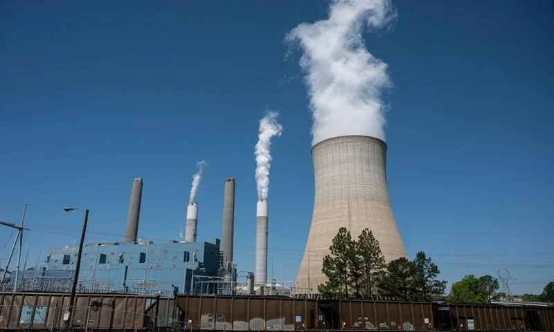 Steam rises from the Miller coal Power Plant in Adamsville, Alabama on April 13, 2021. - The James H. Miller Jr. site faces no immediate shutdown threat and has the backing of many locals because of the jobs it offers -- despite sending about as much planet warming carbon dioxide into the sky last year as 3.7 million cars. The plant highlights a key problem in counteracting climate change -- even for people who have accepted it is happening, the threat can be overshadowed by pressing daily needs like paying bills. That ongoing battle will bring together world leaders this week in Washington as President Joe Biden works to revitalize a global effort left in chaos by his predecessor Donald Trump. (Photo by ANDREW CABALLERO-REYNOLDS / AFP) (Photo by ANDREW CABALLERO-REYNOLDS/AFP via Getty Images)