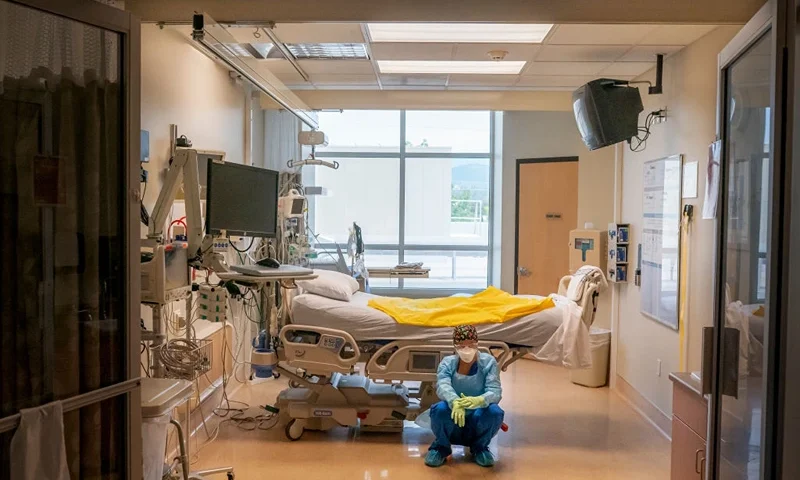 GRANTS PASS, OR - SEPTEMBER 09: (EDITOR'S NOTE: EDITORIAL USE ONLY.) A nurse at Three Rivers Asante Medical Center waits for her next COVID-19 case to be brought from the emergency room shortly after a deceased patient was removed the from the same Intensive Care Unit room on September 9, 2021 in Grants Pass, Oregon. Like many hospitals in the state, Three Rivers Asante is facing their largest COVID-19 surge since the beginning of the pandemic, forcing them to operate well above capacity. (Photo by Nathan Howard/Getty Images)