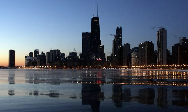 The Chicago skyline glows along Lake Michigan 08 February, 2007 in Chicago, Illinois. Record cold temperatures have been recorded in the mid-west during this recent cold weather. AFP PHOTO/JEFF HAYNES (Photo by JEFF HAYNES / AFP) (Photo by JEFF HAYNES/AFP via Getty Images)