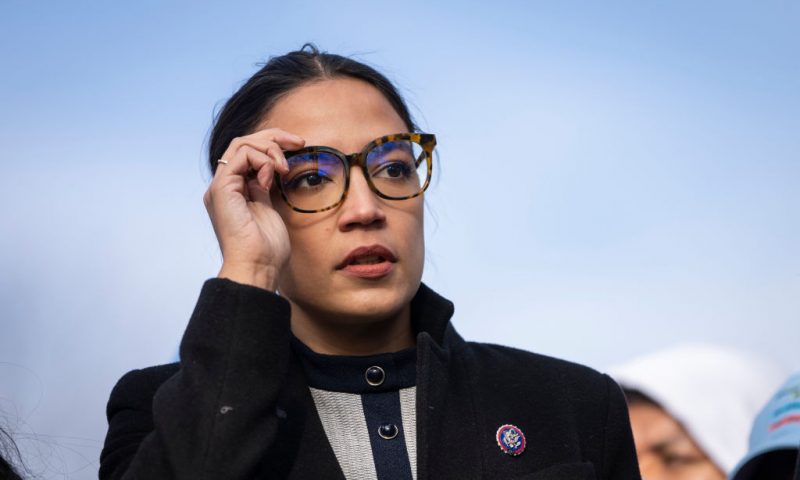 Rep. Alexandria Ocasio-Cortez (D-NY) prepares to speak during a rally for immigration provisions to be included in the Build Back Better Act outside the U.S. Capitol December 7, 2021 in Washington, DC. Progressive Democrats are urging the Senate to include a pathway to citizenship for undocumented immigrants living in the U.S. in the Build Back Better Act. (Photo by Drew Angerer/Getty Images)