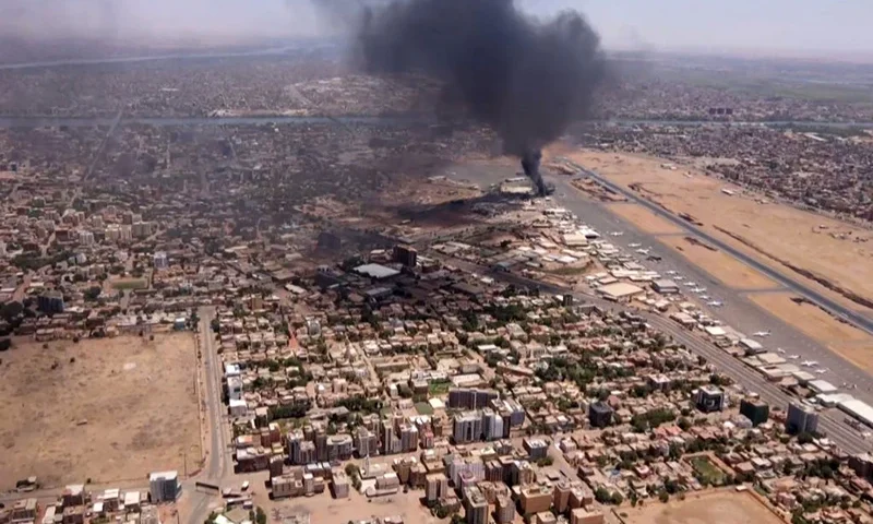 TOPSHOT - This image grab taken from AFPTV video footage on April 20, 2023, shows an aerial view of black smoke rising above the Khartoum International Airport amid ongoing battles between the forces of two rival generals. - Hundreds of people have been killed since the fighting erupted on April 15 between forces loyal to Sudan's army chief Abdel Fattah al-Burhan and his deputy, Mohamed Hamdan Daglo, who commands the paramilitary Rapid Support Forces (RSF). (Photo by AFP) (Photo by -/AFP via Getty Images)