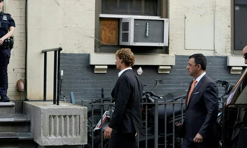 Daniel Penny (C), arrives at the 5th Precinct in New York on May 12, 2023 to turn himself in after being charged with 2nd Degree Manslaughter in the chokehold death of Jordan Neely. The death of Jordan Neely -- widely identified as a Michael Jackson impersonator who often performed on the train -- earlier this month sparked outrage. (Photo by TIMOTHY A. CLARY / AFP) (Photo by TIMOTHY A. CLARY/AFP via Getty Images)
