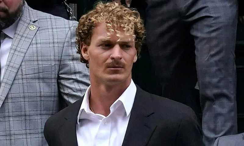 US Marine veteran Daniel Penny is walked out of the New York Police Department 5th Precinct in Lower Manhattan, May 12, 2023 on his way to a arraignment after he surrendered to authorities after being charged with 2nd Degree Manslaughter in the chokehold death of Jordan Neely. The death of Jordan Neely -- widely identified as a Michael Jackson impersonator who often performed on the train -- earlier this month sparked outrage. (Photo by TIMOTHY A. CLARY / AFP) (Photo by TIMOTHY A. CLARY/AFP via Getty Images)