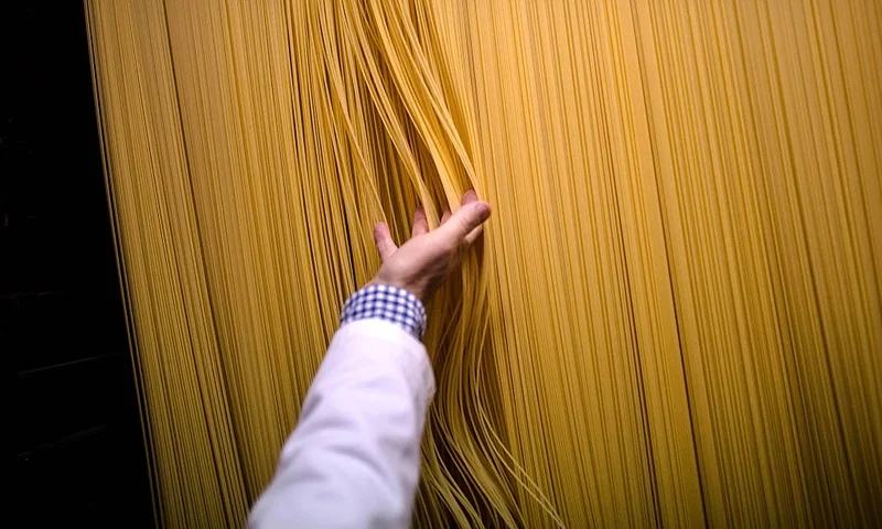 CALDES DE MONTBUI, SPAIN - OCTOBER 27: Carles Sanmarti checks noodles drying in wood cabinets at Pasta Sanmarti factory on October 27, 2015 in Caldes de Montbui, Spain. The Sanmarti family has been involved in the production of pasta since 1700. Carles Sanmarti, the 8th generation descendent, still uses the original recipe using just amber durum wheat semolina, thermal mineral water and egg free. Sanmarti nowadays exports their pasta products to countries as diverse as the United States, China, Denmark and also to the United Kingdom, their largest foreign market. (Photo by David Ramos/Getty Images)