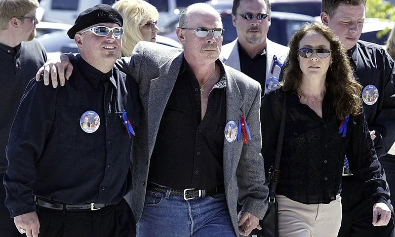 POST FALLS, ID - MAY 25: Steven Groene (C) and family friends arrive at a memorial service for his former wife Brenda K. Groene and their son Slade Groene at the Real Life Ministries May 25, 2005 in Post Falls, Idaho. Groene and her son were found murdered May 16 along with Groene's boyfriend Mark McKenzie at her home north of Coeur d' Alene, Idaho. Two of Groene's children, Shasta, 8, and Dylan, 9, are still missing. (Photo by Jeff T. Green/Getty Images)