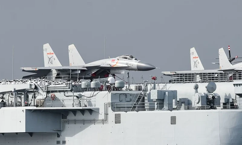 J-15 fighter jets are seen on the flight deck of China's sole aircraft carrier, the Liaoning, as it arrives in Hong Kong waters. (Photo credit should read ANTHONY WALLACE/AFP via Getty Images)