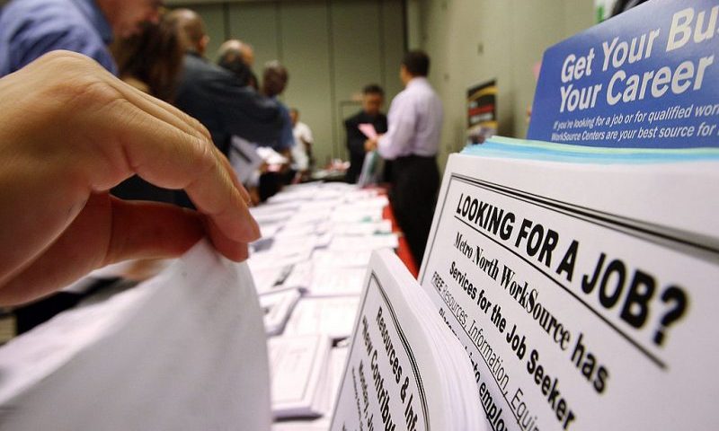 PASADENA, CA - MAY 14: Job seekers look over job opening fliers at the WorkSource exhibit, a collaborative effort by governmental agencies to offer jobs and job training resources at the Greater Los Angeles Career Expo at the Pasadena Convention Center on May 14, 2009 in Pasadena, California. Nineteen exhibitors offer job and educational opportunities as well as advice from the Board of Equalization at the event that is open to the general public. (Photo by David McNew/Getty Images)