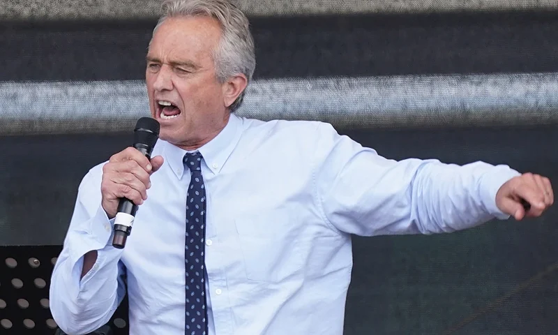 BERLIN, GERMANY - AUGUST 29: Robert F. Kennedy Jr., nephew of former U.S. President John F. Kennedy, speaks to people from a wide spectrum, including coronavirus skeptics, conspiracy enthusiasts, right-wing extremists, religious conservatives, hippies and others gathered under the Victory Column in the city center to hear speeches during a protest against coronavirus-related restrictions and government policy on August 29, 2020 in Berlin, Germany. City authorities had banned the planned protest, citing the flouting of social distancing by participants in a similar march that drew at least 17,000 people a few weeks ago, but a court overturned the ban. (Photo by Sean Gallup/Getty Images)