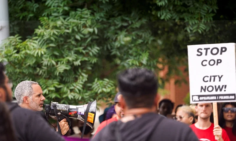 Kamau Franklin speaks as people protest against the controversial "Cop City" project, outside the city hall in Atlanta, Georgia, U.S., May 15, 2023. REUTERS/Megan Varner